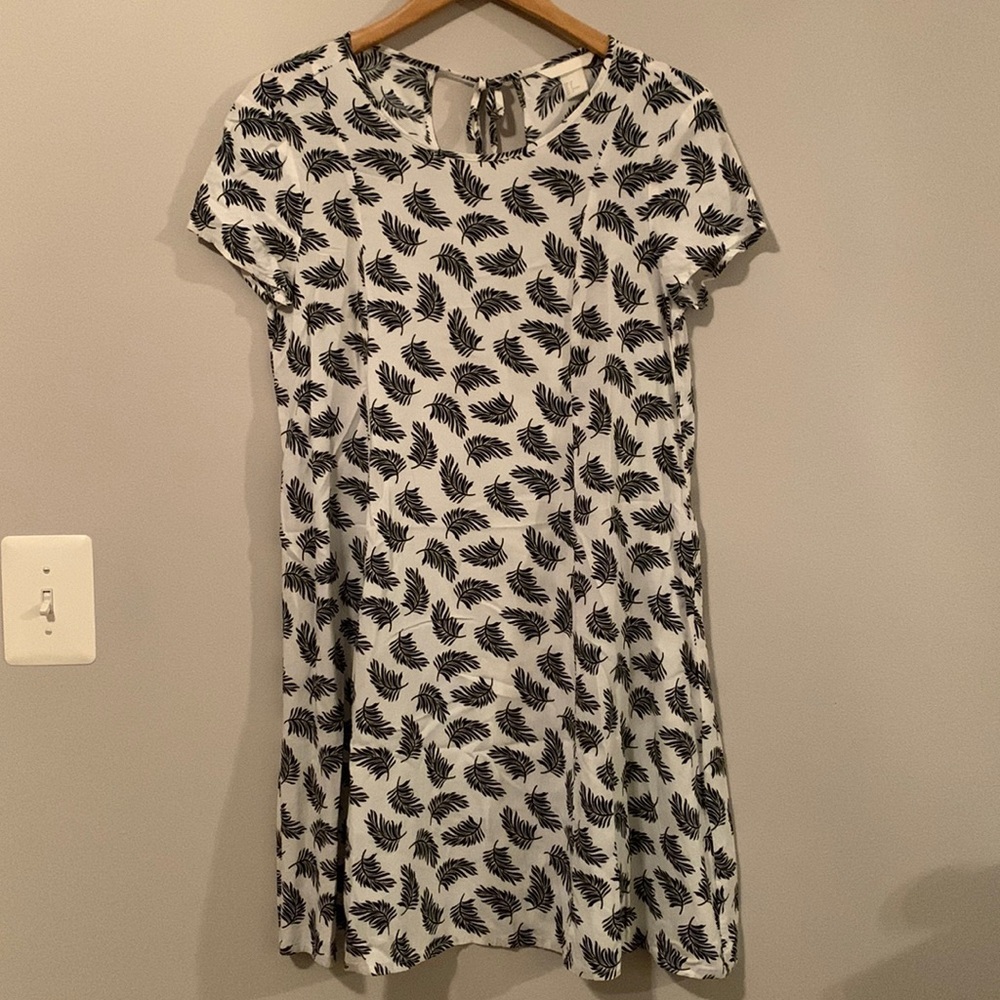 Back and white feather swing dress